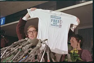 Nicholas Daniloff and Wife Displaying T-shirt
