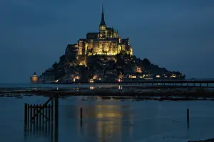 Prints of Mont St Michel settles in for the night as the waters surround it Travel Imagery Prints: Night Glow