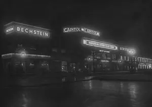 Prints of A nighttime view down Peterstrasse, Berlin, circa 1926. The capitol cinema (centre) is showing Son of the Sheik, starring Rudolph Valentino The Original Latin Lover: Experience the Magnetic Charm of Silent Film’s Most Dashing Heartthrob: Night On Peterstrasse