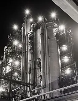 Petroleum Prints: Night View of Oil Refinery with Lights