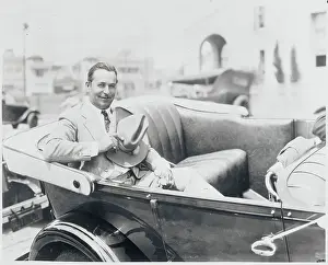 Noah Beery Riding in Automobile