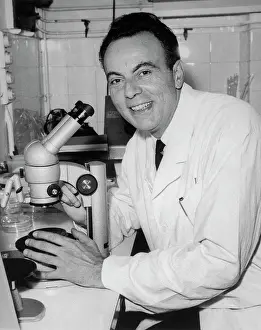 Nobel Prize Winner Francois Jacob Holding Microscope