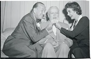 Noel Coward and Jean Simmons Tugging on Frank Sennes Beard