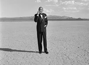 Noel Coward Smoking Cigarette In Desert
