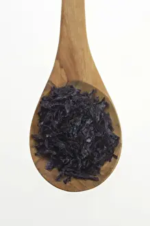 Specialty Prints: Nori (Porphyra tenera) seaweed flakes on an olive wood spoon