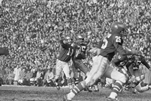 Norm Van Brocklin Passing Football in Championship Game