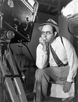 Legs Raised Prints: Norman Taurog Behind Camera/Leg On Chair