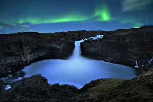 northern lights over Aldeyjarfoss waterfall in Iceland