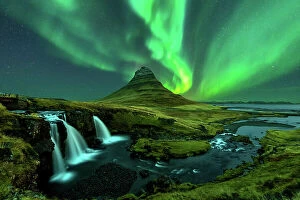 Northern Lights: A Dance of Colours Collection: northern lights appear over Mount Kirkjufell with kirkjufellfoss waterfall in Iceland