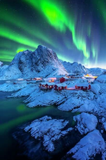 Northern Lights: A Dance of Colours Collection: Northern lights with Festhelltinden peak and Hamnoy, Lofoten Islands. - stock photo