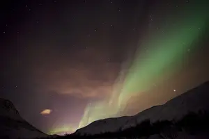 Northern Lights over the Kattfjord pass in winter, Kvaloya, Tromso, Norway, Europe