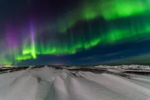 Images Dated 16th February 2016: Northern lights over the snow-capped mountains
