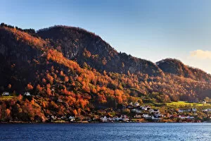 Fjord Collection: Norwegian fjord village drenched in autumn