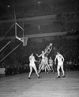 Notre Dame and N.Y.U. Competing in a Basketball Game