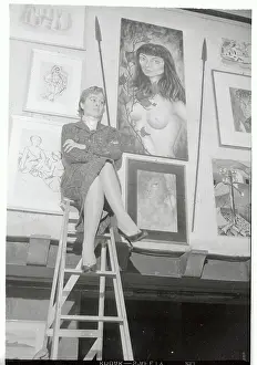 Novella Parigini Sitting With Her Paintings