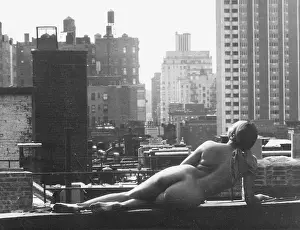 Nude Lounging on Roof
