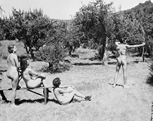 Nudists Practicing Archery