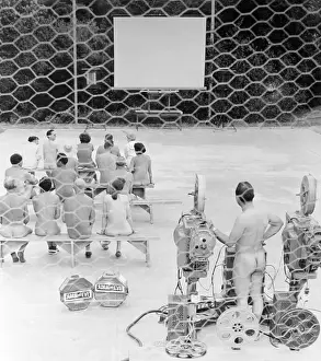 Nudist Prints: Nudists Preparing to Watch Movie