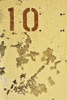 Number Prints: The number ten on crumbling plaster