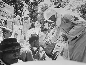 Nun Administer First Aid to a Protester