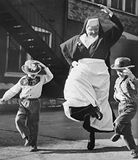 Habit Prints: Nun Dancing with Children
