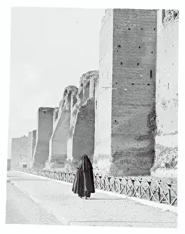 Nun Passing the Roman Wall