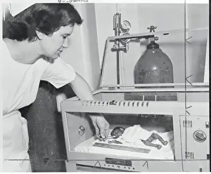 Oklahoma Prints: Nure Feeding Premature Baby