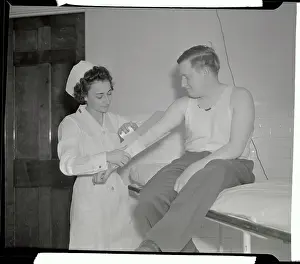 Fort George G Prints: Nurse Applying Splint to Arm of Soldier