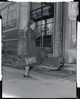 Nurse Boarding Trolley Car