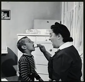 Physical Examination Prints: Nurse Examining Child