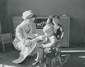 Nurse Giving Vitamins to Children