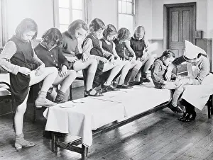 Nurse Inoculating Row of Youngsters