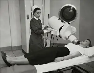 Nurse with Patient During Telecobalt Test