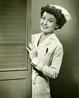 Doors Prints: Nurse peeping trough opened doors, (B&W)