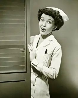 Doors Prints: Nurse peeping trough opened doors, (B&W)