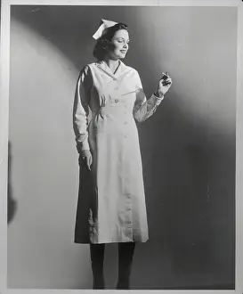 Nurse Reading Thermometer