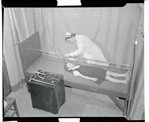 Nurse Recording a Chid's Body Measurements