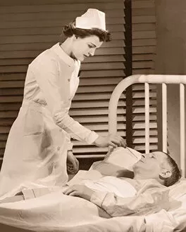 Nurse taking male patients temperature (B&W sepia tone)