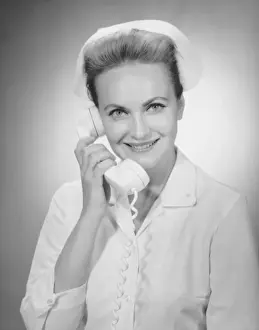 Nurse talking on telephone