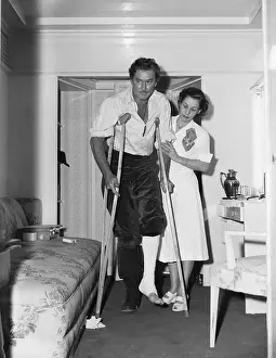 Nurse Visiting Errol Flynn on Crutches