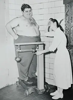 Nurse Weighing Overweight Patient