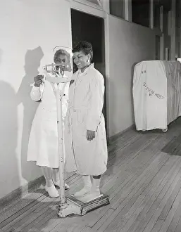 Nurse Weighing Patient