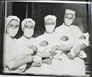 Twins Prints: Nurses Hold Two Sets Of Twins