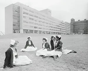 Nurses Lounging on a Lawn