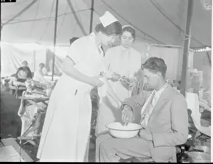 Long Beach Prints: Nurses Tending Injured Man