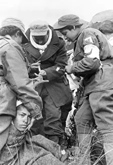Algeria Prints: Nurses Treat Boy's Hand Near Battlefield