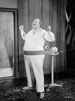 Stomach Prints: Obese Man Singing While Belly is Massaged