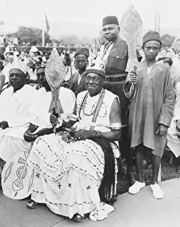 Obi James Okois Ii Surrounded By Attendants