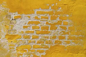Yellow Gallery: Ochre yellow brick wall