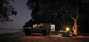 Luggage Prints: Off-road car and evening campsite alongside the Zambezi River